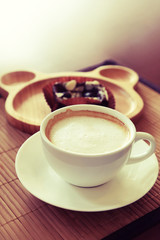 Confectioners atmosphere concept in vintage toned color. Cup of