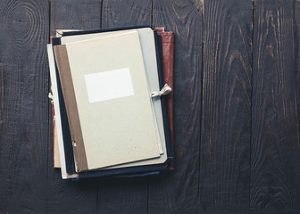 stack of folders on wooden background