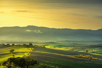 Tuscany countryside misty panorama, rolling hills. Italy