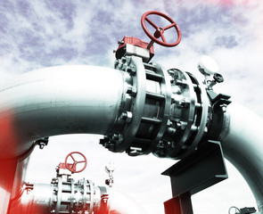 Industrial zone, Steel pipelines and valves against blue sky