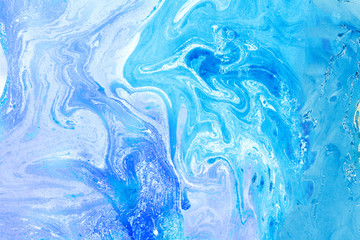 Blur marbling blue-violet texture. Creative background with abstract oil painted waves, handmade surface. Liquid paint.
