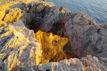 Natural stone arch in the sunset, Cyprus, Akamas