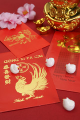 Chinese new year angpow packets with Chinese new year greeting translated in Mandarin. 2017 is known as the year of the chicken according to chinese zodiac.