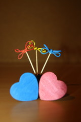 Creative flowers of gum and toothpicks. And two wooden hearts