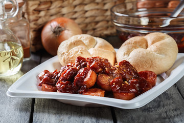 Delicious German currywurst - pieces of sausage with curry sauce
