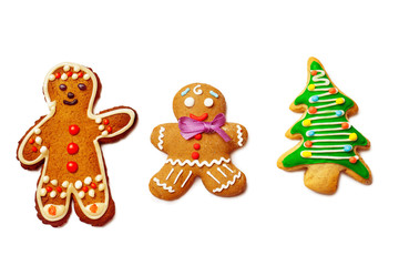 Closeup image of two gingerbread men and christmas tree isolated
