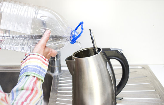 Pouring Water In Kettle