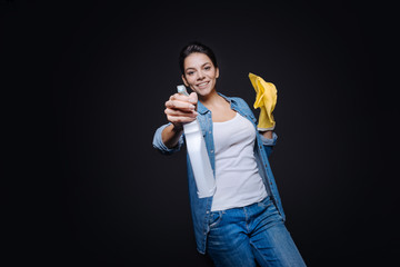 Amused young woman having fun in the studio