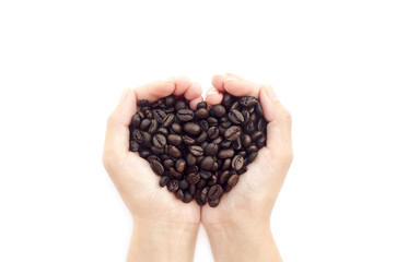 Coffee beans in the hands of heart shaped on White background