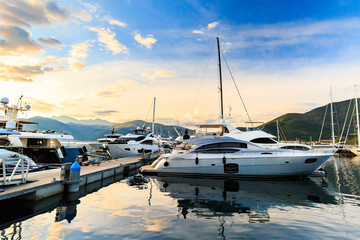 Luxury yacht marina. Port in Mediterranean sea at sunset.