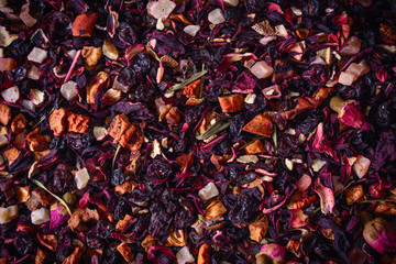 Mix tea with dried fruits and dried flowers. Tea background