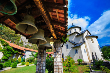Moraca Monastery, a Serbian Orthodox monastery, church bells and courtyard in Kolasin, Montenegro. - obrazy, fototapety, plakaty