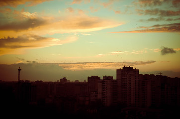 Fototapeta na wymiar Time lapse of sun setting over skyline Kyiv