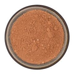 Organic cocoa powder in ceramic bowl isolated on white background, top view