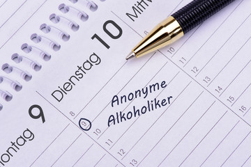 Terminkalender mit Eintrag Treffen der anonymen Alkoholiker