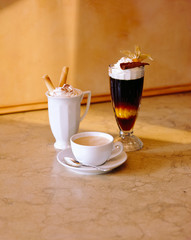 Fototapeta na wymiar Servings of coffee and hot chocolate