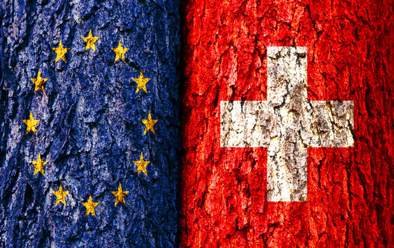 Europe Flag and Switzerland Flag over crack and grunge wall texture background. Forex EURUHF concept.