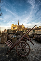 Fototapeta na wymiar Docks of Notre Dame Cathedral in Paris with old barrels, France