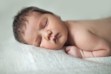 beautiful newborn sleeping baby. close-up portrait