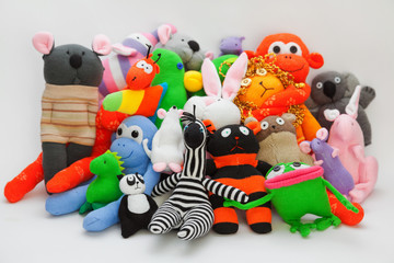 Obraz premium Large group of sock toys on grey background