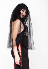 Naklejka premium black widow in a veil, mysterious sad woman wearing lace