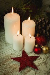 Burning candles in a Christmas wreath
