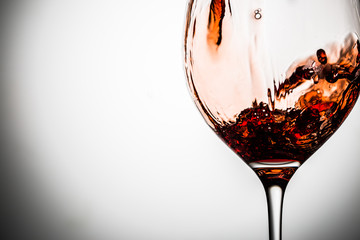 Transparent glass on blank background with red wine