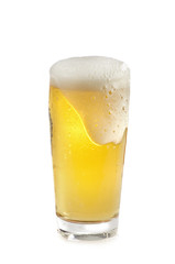 glass of beer pouring over
