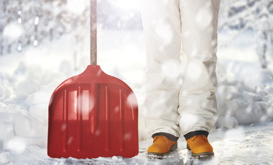 Removing snow with a shovel in the snowfall