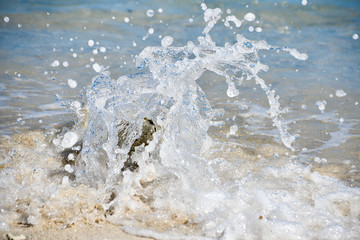 Wave splashing on sandy beach