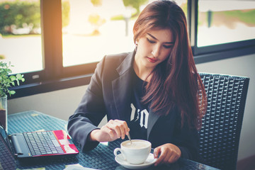office girl drink coffee in happy time