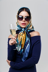 Woman in sunglasses with champagne