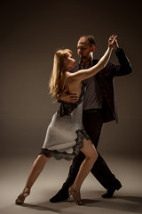 The man and the woman dancing argentinian tango
