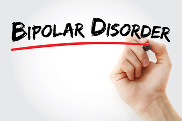 Hand writing Bipolar disorder with marker, concept background