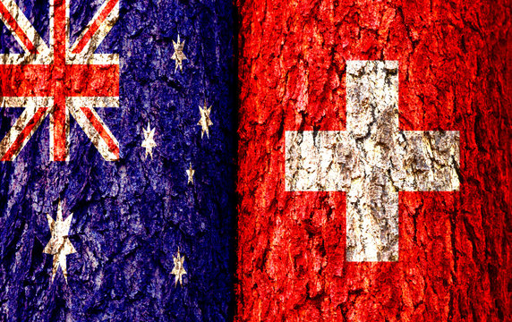Australia Flag and Switzerland Flag over crack and grunge wall texture background. Forex AUDCHF concept.