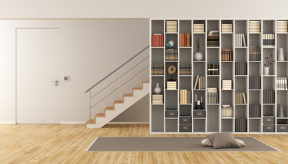 Living room with bookcase and staircase