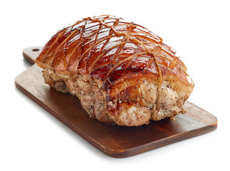 roasted pork on wooden cutting board