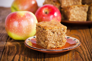 A piece of walnut cake with apples