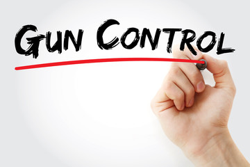 Hand writing Gun control with marker, concept background