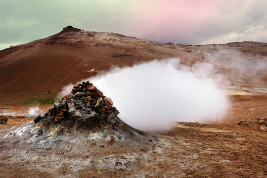 Fumarole evacuating pressurized hot sulfurous gases from volcanic activity in the geothermal area of Hverir Iceland near Lake Myvatn