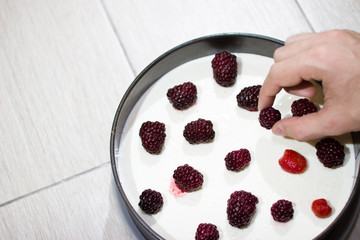 Cooking berry cheesecake.
