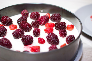 Cooking berry cheesecake.