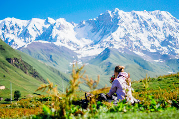 Naklejka na ściany i meble Traveling backpacker girl enjoying Caucasus Mountains in Svaneti, Georgia