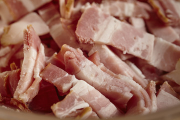 bits of cut up raw bacon