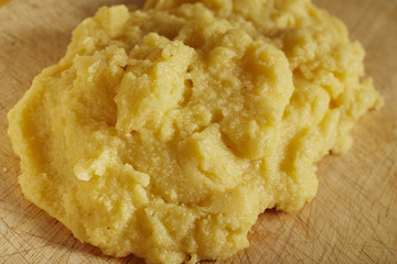  Polenta, the Italian cornmeal dish, served on a wooden board