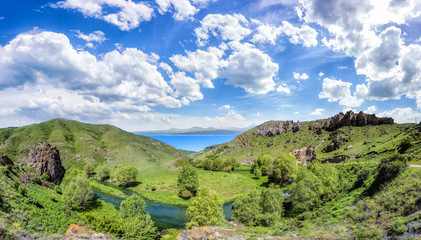 Beautiful landscape with green mountains and magnificent cloudy sky. Exploring Armenia