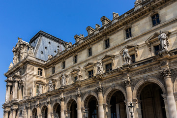 Ancient sculpture on Louvre Museum building. Paris, France.