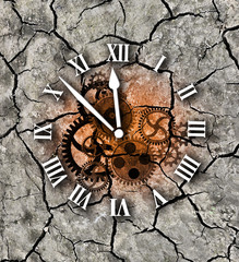 Global warming clock.
Photo-montage with Dry cracked earth and clock symbolizing Global warming.