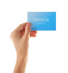 Hand holding card isolated on white