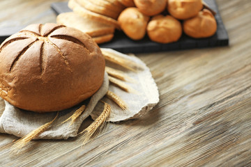 Fresh bread with spikes on a wooden table
